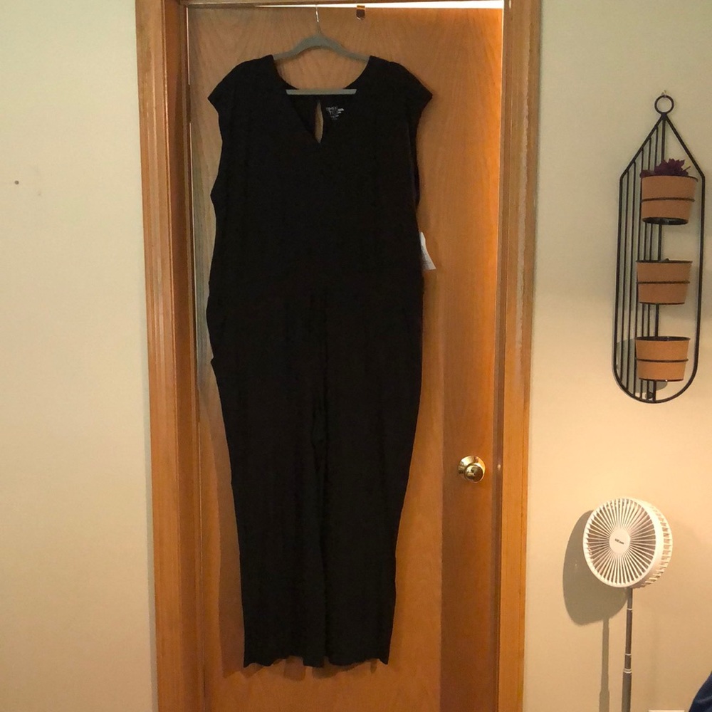 black sleeveless jumpsuit with pockets and drawstring